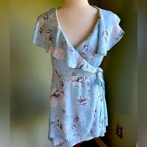 Free People Size S sleeveless wrap ruffle dress. Pale blue w/white blk floral